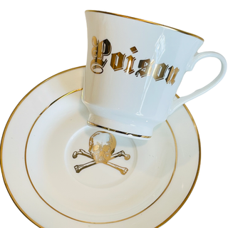 Poison Tea Cup - Holt x Palm -  Introducing the Poison Tea Cup - the coolest way to rock your tea time with a touch of punk. This cup may be deadly (just kidding!), but it'll definitely bring a rebellious edge to your daily routine. Get ready to brew with an attitude! Plated 24k gold material from Germany Dishwasher safe Cup Measures 6" Cup 3.5" w 3.10 h