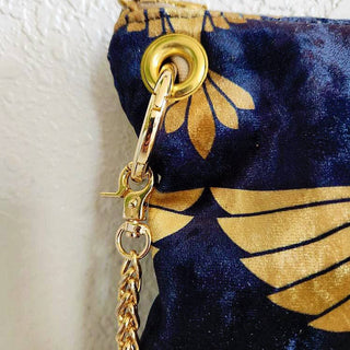 Black and Gold Heron Chain Strap Crossbody Bag - Holt x Palm -  The Black and Gold Heron Crossbody Bag is a beautiful piece to add on your hip. It's slightly smaller than the larger version however still packs a punch. The vintage vibes and crushed velvet exterior offer a touch of elegance, while the large inside pocket and gold velvet lining provide practicality. Made with high-end swivel hardware and an Italian metal zipper closure for a sophisticated finish. *Dimensions approximately 6" H x 9.5" W.