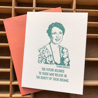 Eleanor Roosevelt Card - Holt x Palm -  Eleanor Roosevelt, "the first lady of the world", advocated for women's rights in the workplace and the civil rights for many. Give this card when you want to inspire and remember one of the great women that made a big impact in American history. • blank inside and measures 4.25”x5.5” folded • folded card is letterpress printed in teal ink on 100% cotton paper • accompanied by an A2 papaya envelope and packaged in a clear sleeve