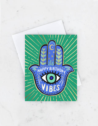 Hamsa Birthday Card - Holt x Palm -  Our hand-painted hamsa is painted in colorful jade and cobalt shades, accented with shiny gold foil detail. The perfect card for sending the best birthday vibes. • HEAVY, MATTE EGGSHELL STOCK • BLANK INSIDE • 4 3/4″ X 5 1/2″ • PAIRED WITH MATCHING ENVELOPE