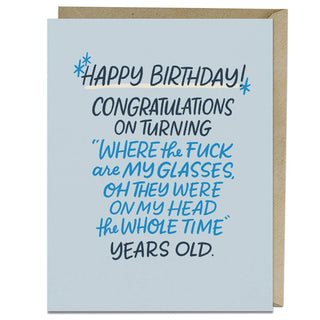 Where Are My Glasses Years Old Birthday Card - Holt x Palm -  Under the cat? In a coat pocket? At the bank? WHERE ARE YOUR GLASSES? And why is the top of our head the last place we look? (The glasses are always on top of our head. Unless they're not…) • Blank card, A2 size (4.25 x 5.5 inches) • Printed on heavyweight uncoated stock • Comes with a matching kraft envelope • Comes in card sleeve derived from plant-based PLA that is certified compostable