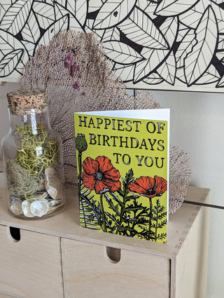 Greeting card | happiest of birthdays poppies - Holt x Palm -  Happiest of Birthdays to You! Featuring poppy and fern illustrations by ilikesara / Sara Schalliol-Hodge, this card was designed especially for celebrating that uplifting person in your life. -measures 4.5" x 5.5" when folded -printed on 100 lb white cover paper -includes kraft envelope -blank interior -shipped in a clear cellophane sleeve inside a rigid cardboard mailer -designed and printed in Denver, Colorado