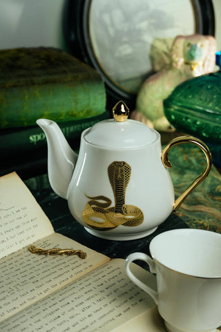 The Most Adorable Cobra Teapot w/ Gift Box - Holt x Palm -  Sippin' tea never looked so cool! Check out our ceramic 24K gold laced Cobra tea-pot...pair this beauty with one of our Poison or Queen tea cups and you have the most unique and unexpected gift for someone amazing...or yourself :-). You deserve it! Plated 24K gold material from Germany. 6" H (including lid) 6" L (handle to spout) 5" W.