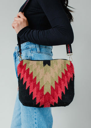 Black, Green & Red Aztec Crossbody Tote - Holt x Palm -  Get ready to turn heads with our Black, Green & Red Aztec Crossbody Tote! This bohemian-inspired bag is equal parts cool and stylish, making it the perfect accessory for any outfit. Say goodbye to boring purses and hello to a one-of-a-kind statement piece. (Tote-ally a must-have!) Black, green & red Aztec crossbody bag Removable strap 8" x 12" x 4" 100% Cotton