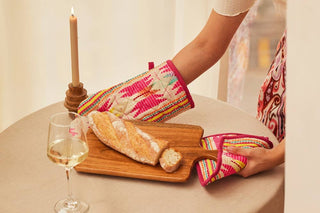 Pink Star Oven Mitts & Pot Holder/ Set Of 2 - Holt x Palm -  Featuring bright tribal prints, this set of potholder and oven mitt is a perfect holiday gift for the resident chef. • Handcut & stitched by local artisans in Karur, India • Oven Glove - 7" x 13" • Pot Holder - 8" • Perfect Gift for Christmas or Holiday