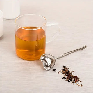 Stylish Heart-Shaped Stainless Steel Tea Infuser, Brewing - Holt x Palm -  Discover the elegance of simplicity with our Heart-Shaped Tea Infuser. Crafted from premium stainless steel, this charming tea infuser is perfect for brewing loose leaf teas with precision and style. Its sleek design and functional hinge promise both durability and ease of use, making it an ideal choice for high-end retailers and boutique shops. Elevate your tea experience with a touch of love! 🍵❤️