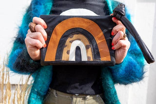 Up-Cycled Gold / Silver Leather Rainbow Clutch - Holt x Palm -  The perfect clutch to enlighten your day. Individually hand made in our studio in Lake Tahoe, California. (the one you will get is the 1st pic) Re purposed vintage jacket leather, leather scrap from U.S. Factories and recycled denim. 9.5" rose gold zipper. Detachable leather wrist strap. Lined with hemp chambray. Measures 10" x 7".