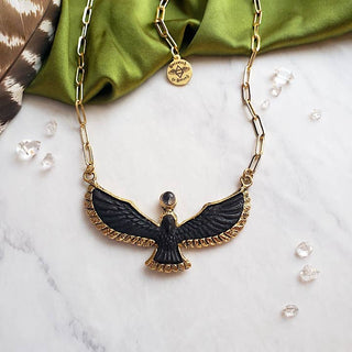 Carved Ebony Bird Necklace - Holt x Palm -  Each bird carving is unique and one of a kind, set in high quality brass. A reminder of having a higher consciousness perspective on life. Mind your way and stay focused. Crowning the bird is a Quartz Crystal Sphere Moon symbolizing your spiritual intuition and connection with life. Adjustable 14k gold plated brass 20" chain