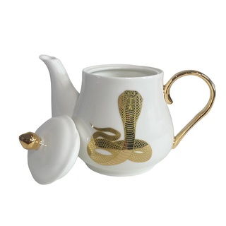 The Most Adorable Cobra Teapot w/ Gift Box - Holt x Palm -  Sippin' tea never looked so cool! Check out our ceramic 24K gold laced Cobra tea-pot...pair this beauty with one of our Poison or Queen tea cups and you have the most unique and unexpected gift for someone amazing...or yourself :-). You deserve it! Plated 24K gold material from Germany. 6" H (including lid) 6" L (handle to spout) 5" W.