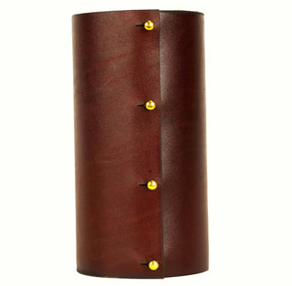 "The Rockstar" Luxury Leather Wrapped Vase - Holt x Palm -  Beautifully wrapped in fine leather and adorned with 60 multi-colored solid brass studs. Named the "Rockstar" its got attitude, swagger and sexy as hell! Each piece is meticulously hand studded to order. We use 4 solid brass "button" posts to fasten the leather to the glass vessel, the leather wrap is removeable for cleaning. 8" tall x 4" wide