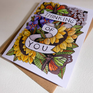 Thinking Of You Card - Holt x Palm -  • Greeting Card Illustrated by Cayla Mattea Zeek • Created in Lafayette, Louisiana USA • A2 Card Measures 4.25" x 5.5" Folded • Blank Inside • Printed on Post Consumer Waste Recycled Heavy Card-Stock Paper • Recycled Kraft Brown Envelope • Eco Clear Plant-Based PLA (Polylactic Acid) Sleeve, Commercially Compostable