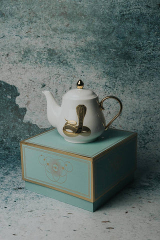 The Most Adorable Cobra Teapot w/ Gift Box - Holt x Palm -  Sippin' tea never looked so cool! Check out our ceramic 24K gold laced Cobra tea-pot...pair this beauty with one of our Poison or Queen tea cups and you have the most unique and unexpected gift for someone amazing...or yourself :-). You deserve it! Plated 24K gold material from Germany. 6" H (including lid) 6" L (handle to spout) 5" W.