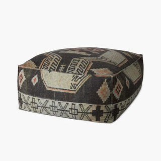 The Black Tribal Pouf - Holt x Palm -  Inspire the room with style and pizzazz! The Black Tribal Pouf brings a truly unique piece of decor to your home—an eye-catching accent that screams "so cool!" without sacrificing your tribal chic style. Add this piece to your collection, and watch heads turn! 36"W x 36"D x 17"H