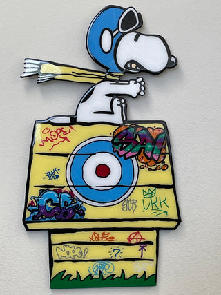 Top Gun by Jim Armstrong - Holt x Palm -  Add a pop of fun to your walls with Top Gun by Jim Armstrong! Measuring 27" x 16", this mixed media piece features a classic Snoopy in pop art form. A playful addition to any room.