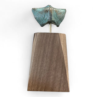 Blue Fossil Sculpture - Holt x Palm -  This stunning blue fossil sculpture, mounted on locally sourced wood, will bring a touch of beauty and history to any space. The unique blue color adds a pop of vibrancy and the use of locally sourced wood ensures sustainability. A must-have piece for any art lover and eco-conscious individual!