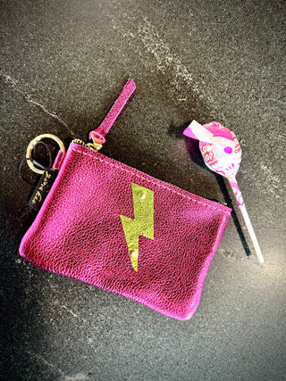 The Cutest Up-Cycled Leather Lightening Bolt Pouch You Ever Did See.... - Holt x Palm -  We love these little pouches!! They just keep your purse organized in style. Use them for Airpods, cash, ID, pills, whathaveyou! It's your little good time pouch...attach it to your purse or just your belt buckly and go out and have you a good 'ol time! Buy a few for friends...they will adore them! DETAILS: Measures 5"x3.5". Unlined. Brass zipper and key ring Appliques are hand cut and attached with mini rivets.