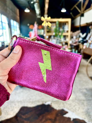 The Cutest Up-Cycled Leather Lightening Bolt Pouch You Ever Did See.... - Holt x Palm -  We love these little pouches!! They just keep your purse organized in style. Use them for Airpods, cash, ID, pills, whathaveyou! It's your little good time pouch...attach it to your purse or just your belt buckly and go out and have you a good 'ol time! Buy a few for friends...they will adore them! DETAILS: Measures 5"x3.5". Unlined. Brass zipper and key ring Appliques are hand cut and attached with mini rivets.