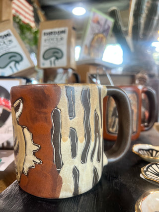 Rusitc Hand Painter Stoneware Tiger Mug - Holt x Palm -  Channel your inner tiger! Appreciate handcrafted goodness every morning with this amazing piece of art... 4.5 inches tall and holds up to 16 oz. Microwave and dishwasher safe, with lead-free paint. Made in Mexico.