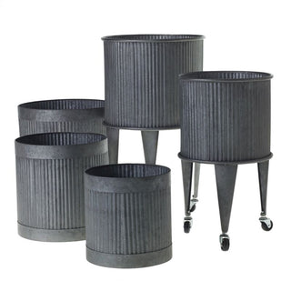 Sheet Metal Collection - Holt x Palm -  Unleash your outdoor green thumb potential with our Sheet Metal Pot. Made from sheet metal, its simple modern design adds a touch of style to any outdoor setting while providing practical potting features. It's perfect for any outdoor space. Available in 2 Styles: Pot - 11.75" x 12" Cart on Wheels - 14.25" x 24"