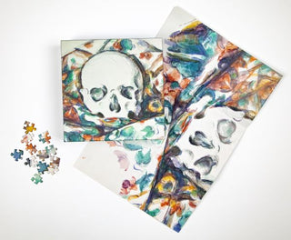 Paul Cezanne - Skull  on a Curtain 1000 Piece Puzzle - Holt x Palm -  This 1,000-piece jigsaw puzzle creates a big 20 x 20 inch finished piece. Beautifully printed images on puzzle board using the best art, past and present. Packaged in a compact 2-piece box with bonus folded art poster to use as a guide.