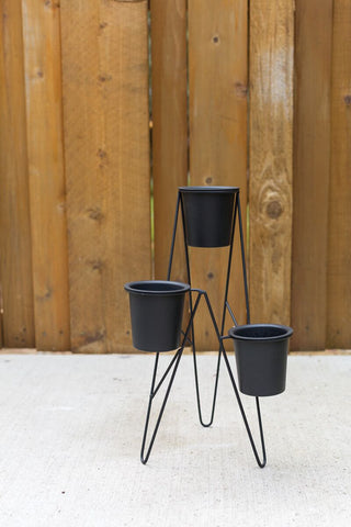 Three Tiered Plant Stand - Holt x Palm -  Display your plants in style with our Three Tiered Plant Stand! Made of powder coated metal with hairpin lines, this stand is both sturdy and trendy. Its perfect trio planter design allows for easy arrangement of your plants. Measuring 11.75" x 9.75" x 17", it's the perfect size for any space.