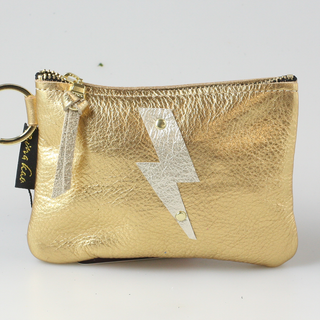 The Cutest Up-Cycled Leather Lightening Bolt Pouch You Ever Did See.... - Holt x Palm -  We love these little pouches!! They just keep your purse organized in style. Use them for Airpods, cash, ID, pills, whathaveyou! It's your little good time pouch...attach it to your purse or just your belt buckly and go out and have you a good 'ol time! Buy a few for friends...they will adore them! DETAILS: Measures 5"x3.5". Unlined. Brass zipper and key ring Appliques are hand cut and attached with mini rivets.