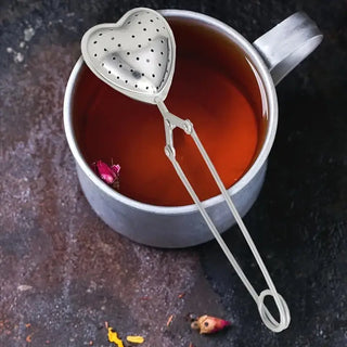 Stylish Heart-Shaped Stainless Steel Tea Infuser, Brewing - Holt x Palm -  Discover the elegance of simplicity with our Heart-Shaped Tea Infuser. Crafted from premium stainless steel, this charming tea infuser is perfect for brewing loose leaf teas with precision and style. Its sleek design and functional hinge promise both durability and ease of use, making it an ideal choice for high-end retailers and boutique shops. Elevate your tea experience with a touch of love! 🍵❤️