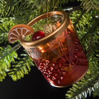 Old Fashioned Cocktail Holiday Ornament Chritmas Decor - Holt x Palm -  Nothing warms the heart and soul quite like the classic Old Fashioned. This ornament looks good enough to sip with its frosty ice and detailed garnishes of cherry and orange. No whiskey lovers’ tree is complete without this hand-blown and hand-painted ornament. The perfect gift for yourself or others! Comes packaged in a custom-made box printed with a retro holiday design that’s just too good to hide with wrapping paper. 3.75 x 2.75”