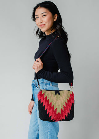 Black, Green & Red Aztec Crossbody Tote - Holt x Palm -  Get ready to turn heads with our Black, Green & Red Aztec Crossbody Tote! This bohemian-inspired bag is equal parts cool and stylish, making it the perfect accessory for any outfit. Say goodbye to boring purses and hello to a one-of-a-kind statement piece. (Tote-ally a must-have!) Black, green & red Aztec crossbody bag Removable strap 8" x 12" x 4" 100% Cotton