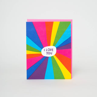 Rainbow I Love You Letterpress Greeting Card - Holt x Palm -  Spread love and joy with our Rainbow I Love You Letterpress Greeting Card. With vibrant colors and a heart-warming message of 'I love you', this card will surely brighten anyone's day. Perfect for any occasion, it's a thoughtful way to express your happiness and love. All about this card: Comes with a fluorescent pink envelope. Dimensions: A2 (4.25 x 5.5 inches).