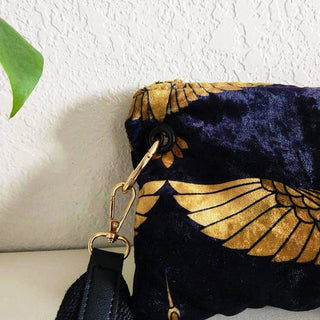 Small Black and Gold Heron Crossbody Bag - Holt x Palm -  The Black and Gold Heron Crossbody Bag is a beautiful piece to add on your hip. It's slightly smaller than the larger version however still packs a punch. The vintage vibes and crushed velvet exterior offer a touch of elegance, while the large inside pocket and gold velvet lining provide practicality. Made with high-end swivel hardware and an Italian metal zipper closure for a sophisticated finish. *Dimensions approximately 6" H x 9.5" W.