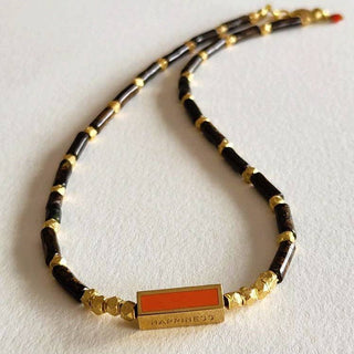 Mocha Jasper Message Necklace - Holt x Palm -  This Mocha Jasper Message Necklace features a unique brass focal from Europe that adds a touch of elegance to any outfit. With 22kt gold beads over copper, this necklace offers a luxurious look, while the lobster claw clasp ensures secure wear. Measuring 16 inches long, it's the perfect length for everyday wear.