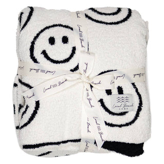 Smiley Luxe Home Blanket - Holt x Palm -  Introducing the Local Beach Home Collection featuring luxurious and incredibly cozy XL blankets. Reversible 100% Feather Knit construction with an ultra soft hand. Perfect for home, travel, and beyond. Cozy up and stay warm with the softest blanket ever. Reversible =Top side is light color, bottom side is dark color • 100% Polyester Microfiber • XL Blanket, Double layer 54" W x 72" L • No fading, shed free Care: Machine Wash Cold, Gentle Cycle. Air or tumble dry low