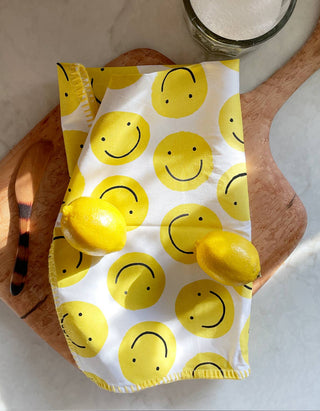 Smiley Tea Towel - Holt x Palm -  Our vibrant tea towels are just the thing to add a touch of colorful flair to your kitchen, or a thoughtful hostess/housewarming gift! Woven from 100% absorbent cotton and printed with our charming, hand-painted designs, each towel is embellished with contrasting embroidery along the seaming. €¢ 21€³ X 28€³ €¢ HANGING LOOP €¢ EMBROIDERED TRIM