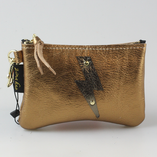 The Cutest Up-Cycled Leather Lightening Bolt Pouch You Ever Did See.... - Holt x Palm -  We love these little pouches!! They just keep your purse organized in style. Use them for Airpods, cash, ID, pills, whathaveyou! It's your little good time pouch...attach it to your purse or just your belt buckly and go out and have you a good 'ol time! Buy a few for friends...they will adore them! DETAILS: Measures 5"x3.5". Unlined. Brass zipper and key ring Appliques are hand cut and attached with mini rivets.