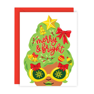 Merry & Bright - Holt x Palm -  Send some holiday cheer with our Merry & Bright Big Hair Lady Christmas card! This card features a playful design and a message that will surely make anyone smile. Spread some joy this season with this fun and festive card. • Folded Card, 4 1/4 x 5 1/2" (A2 Size)• Blank Inside • Includes Red Envelope