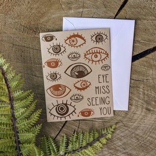 Greeting card | eye miss seeing you - Holt x Palm -  eye miss seeing you based on blockprints by ilikesara / Sara Schalliol-Hodge -card measures 4.25" x 5.5" when folded -printed on 100 lb light kraft cover paper -white envelope included -blank interior -shipped in a clear cellophane sleeve inside a rigid cardboard mailer Designed and printed in Denver, Colorado.