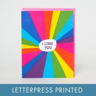 Rainbow I Love You Letterpress Greeting Card - Holt x Palm -  Spread love and joy with our Rainbow I Love You Letterpress Greeting Card. With vibrant colors and a heart-warming message of 'I love you', this card will surely brighten anyone's day. Perfect for any occasion, it's a thoughtful way to express your happiness and love. All about this card: Comes with a fluorescent pink envelope. Dimensions: A2 (4.25 x 5.5 inches).