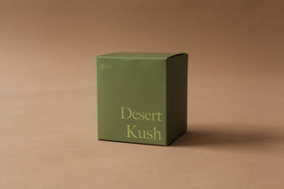 Desert Kush Candle - Holt x Palm -  Light up the 'DESERT KUSH CANDLE' for a scorching hot time. This clean burning, good smelling candle adds a hip and cool vibe to your space. Feel the heat (but in a good way)! Top Notes: Tangelo - Italian Bergamot Heart: Cannabis Flower - Cypress - Moss Base: Vetiver - Patchouli - Leather 8.5 ounces Burns 45 Hours All candles are Phthalate-free, using cotton wicks with no lead cores for safer, cleaner burning.