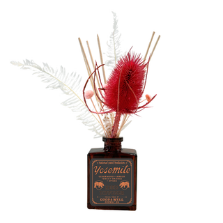 Yosemite National Park Botanical Floral Reed Diffuser - Holt x Palm -  Notes of cedarwood, amber and sweet orange. Immerse yourself in the rugged beauty of Glacier with fresh huckleberry, crisp balsam and bright bergamot. This scent captures the mountain air and forested trails of the park’s untamed wilderness, bringing a refreshing, flame-free escape right into your home. Rattan reeds with preserved white star fern, pink larkspur & pink button flowers. 4 fl oz. Lasts up to 6 months.