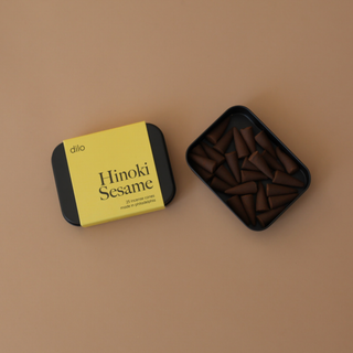 Hinoki Sesame Cone Incense - Holt x Palm -  Tin contains 25 Incense Cones - Resin + Fragrance Fragrance Profile: Hinoki Sesame - Coastal Sea Salt Air rises through Centuries-Old Hinoki Cypress Trees Designed and poured at dilo Studios in Philadelphia.