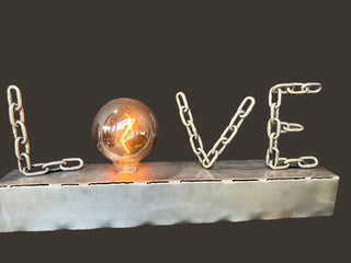 Love Lamp - Holt x Palm -  Introducing the Love Lamp - bringing a touch of handmade metal work and a whole lotta love to your space. Simply tap to illuminate and bask in its warm glow. Perfect for adding a cozy and unique touch to any room. Share the love and light up your life with the Love Lamp! 25" x 3.5" x 4.5"