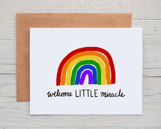 Welcome Little Miracle Rainbow Baby Card - Holt x Palm -  The rainbow is a miracle and so is the new little human :-) DESIGN: Digital art created in Procreate MATERIALS: Printed on 110# white cardstock. Includes a craft paper envelope SIZE: A2, folded INSIDE: Blank inside