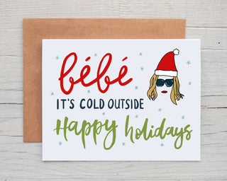Bebe It’s Cold Outside - Moira Rose Holiday Card - Holt x Palm -  Bebe It’s Cold Outside - Moira Rose Holiday Card DESIGN: Digital art created in Procreate MATERIALS: Printed on 110# white cardstock. Includes a craft paper envelope SIZE: A2, folded INSIDE: Blank inside