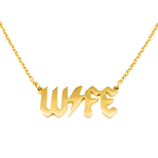 Gold "Wife" Necklace - Holt x Palm -  "Make a bold statement with this Gold WIFE Necklace. The punk rock design will add some edge to any outfit, while the approximately 18 inch chain length is perfect for everyday wear. Let your WIFE know she's one of a kind (and appreciated) with this unique accessory!"