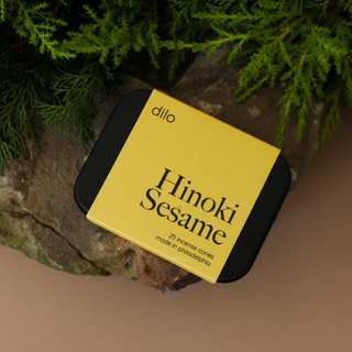 Hinoki Sesame Cone Incense - Holt x Palm -  Tin contains 25 Incense Cones - Resin + Fragrance Fragrance Profile: Hinoki Sesame - Coastal Sea Salt Air rises through Centuries-Old Hinoki Cypress Trees Designed and poured at dilo Studios in Philadelphia.