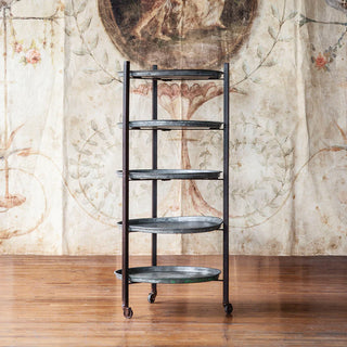 Bakery Rack with Trays - Holt x Palm -  23'' dia x 50'' Vintage baking trays have been sourced from commercial bakeries in India and re-purposed into multi-functional shelving. Great for storage and display on rolling and folding iron frame. Countless breads and sweets pulled fresh from the oven give the trays their gorgeous patina.