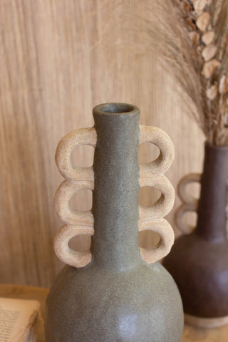 Ceramic Bottles with Ring Handles - Holt x Palm -  Bring a rustic, eclectic touch to your decor with these Ceramic Bottles with Ring Handles. Quirky and guaranteed to cause double-takes, these charming pieces will have your guests thinking you raided a more magical flea market! Looking for a real conversation starter? Look no further - they're here waiting to wow. (comes in 3 different Colors/Style Variations White: Single Ring Purple: Double Ring Gray: Triple Ring