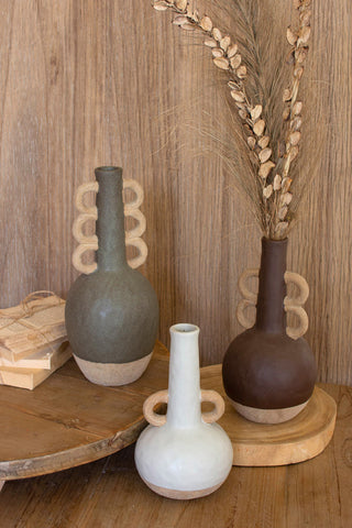 Ceramic Bottles with Ring Handles - Holt x Palm -  Bring a rustic, eclectic touch to your decor with these Ceramic Bottles with Ring Handles. Quirky and guaranteed to cause double-takes, these charming pieces will have your guests thinking you raided a more magical flea market! Looking for a real conversation starter? Look no further - they're here waiting to wow. (comes in 3 different Colors/Style Variations White: Single Ring Purple: Double Ring Gray: Triple Ring