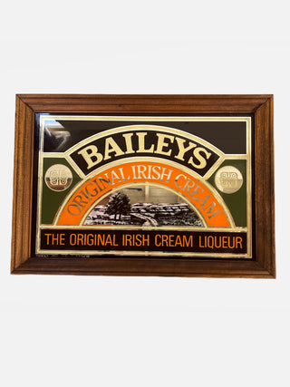 Bailey's Irish Creamer Mirror - Holt x Palm -  Let your reflection shine bright with this Bailey's Irish Creamer Mirror! Not only does this vintage mirror make a beautiful addition to any room, the creamy essence of Bailey's will remind you just how sweet life can be. A perfect gift for the Bailey's lover in your life, or a treat for yourself - you'll never be able to look away! 14 1/2" x 20 1/2"